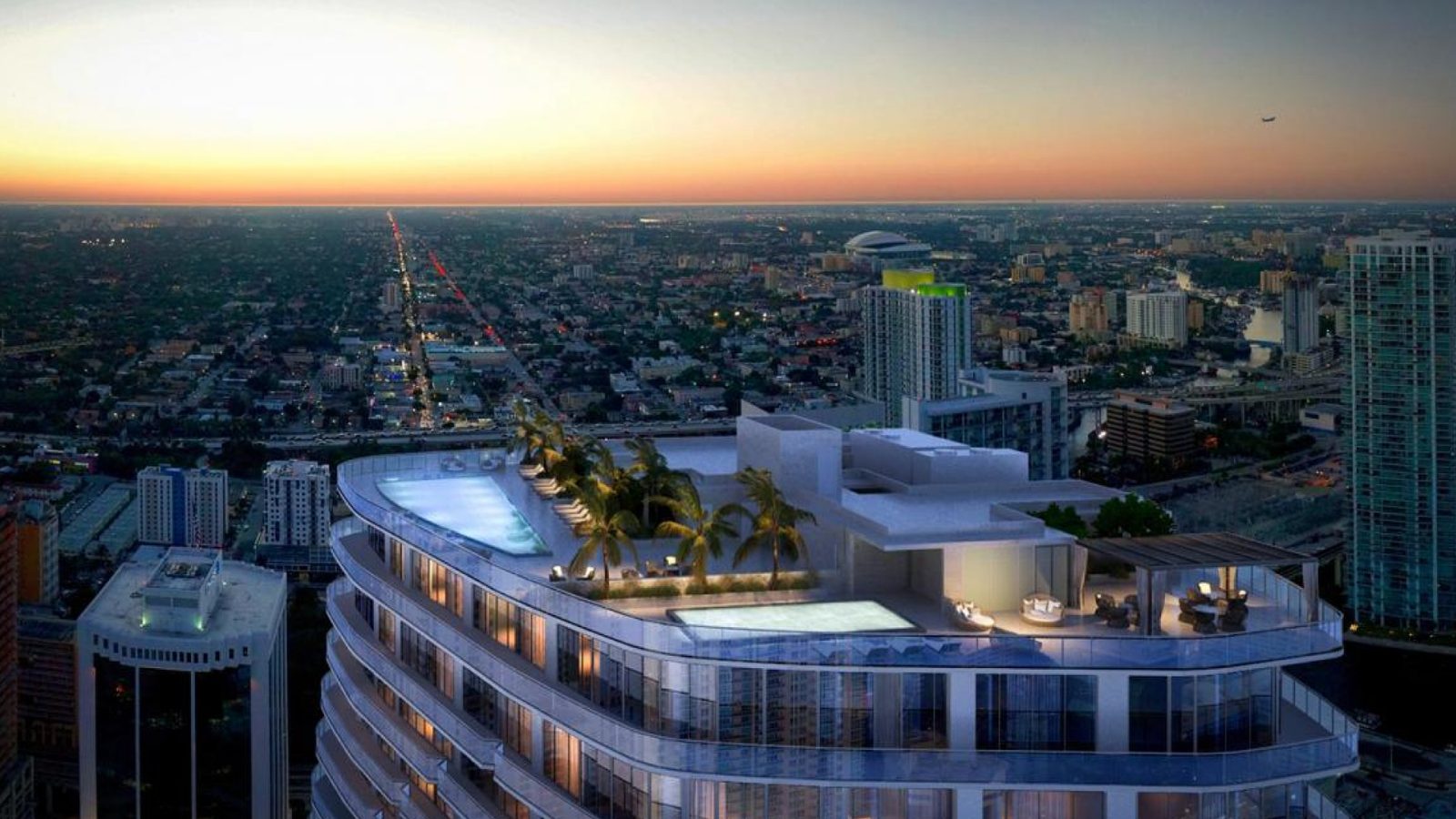 SLS Lux Brickell: the rooftop pool deck above Brickell at dusk.